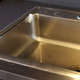 Image for article titled Ice Cube Thrown Into Sink Flies Up Side Like Skateboarder Shredding Half-Pipe